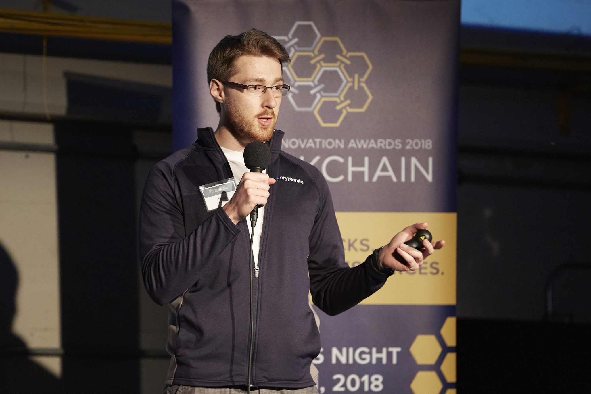 Michael Brenndoefer speaking on stage